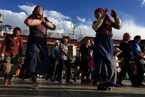 Pilgrims walk Lhasa's Lingkor circuit on Saga Dwa